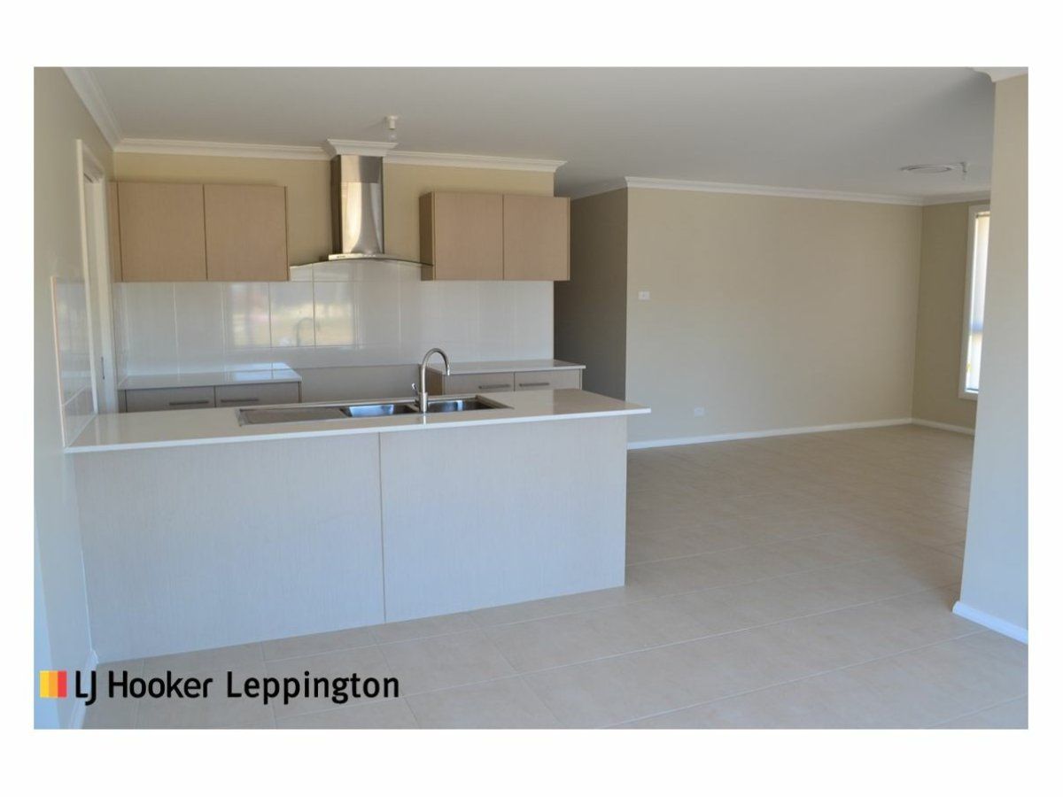 4 bedrooms House in 9 Glycine Street DENHAM COURT NSW, 2565